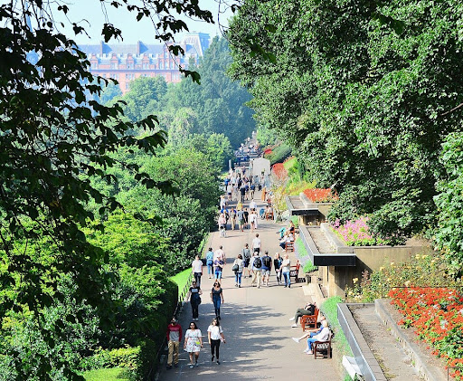 Professional delegates networking in a park near the management conference venue in Edinburgh