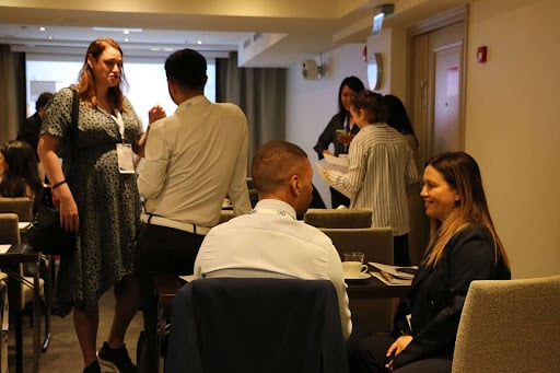 Professional delegates networking at a management conference venue in Scotland.